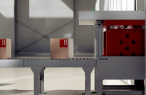 Boxes going into an AutoStore system on a conveyor belt.