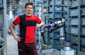 Jan Zizka standing next to Brightpick's Autopicker.