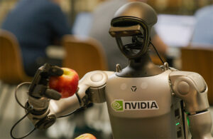 a humanoid robot holding an apple.